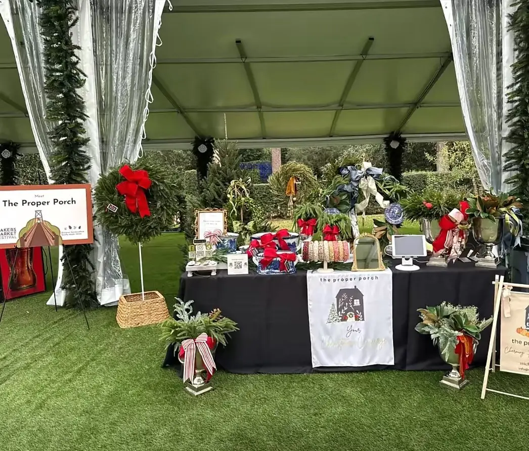 Our booth at the Makers Market Festival with fresh wreaths and holiday decor