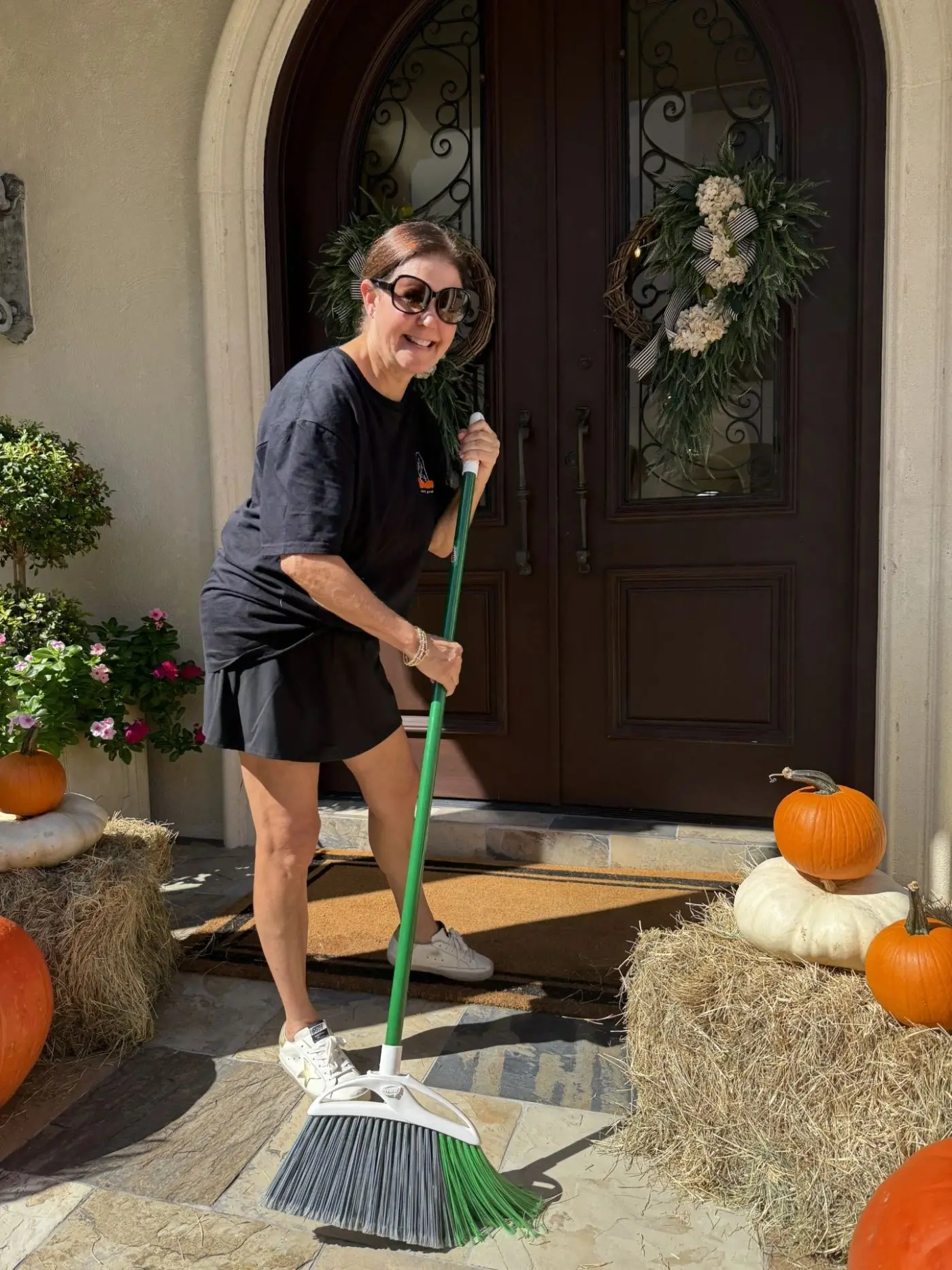 Michelle finishing a pumpkin porch install