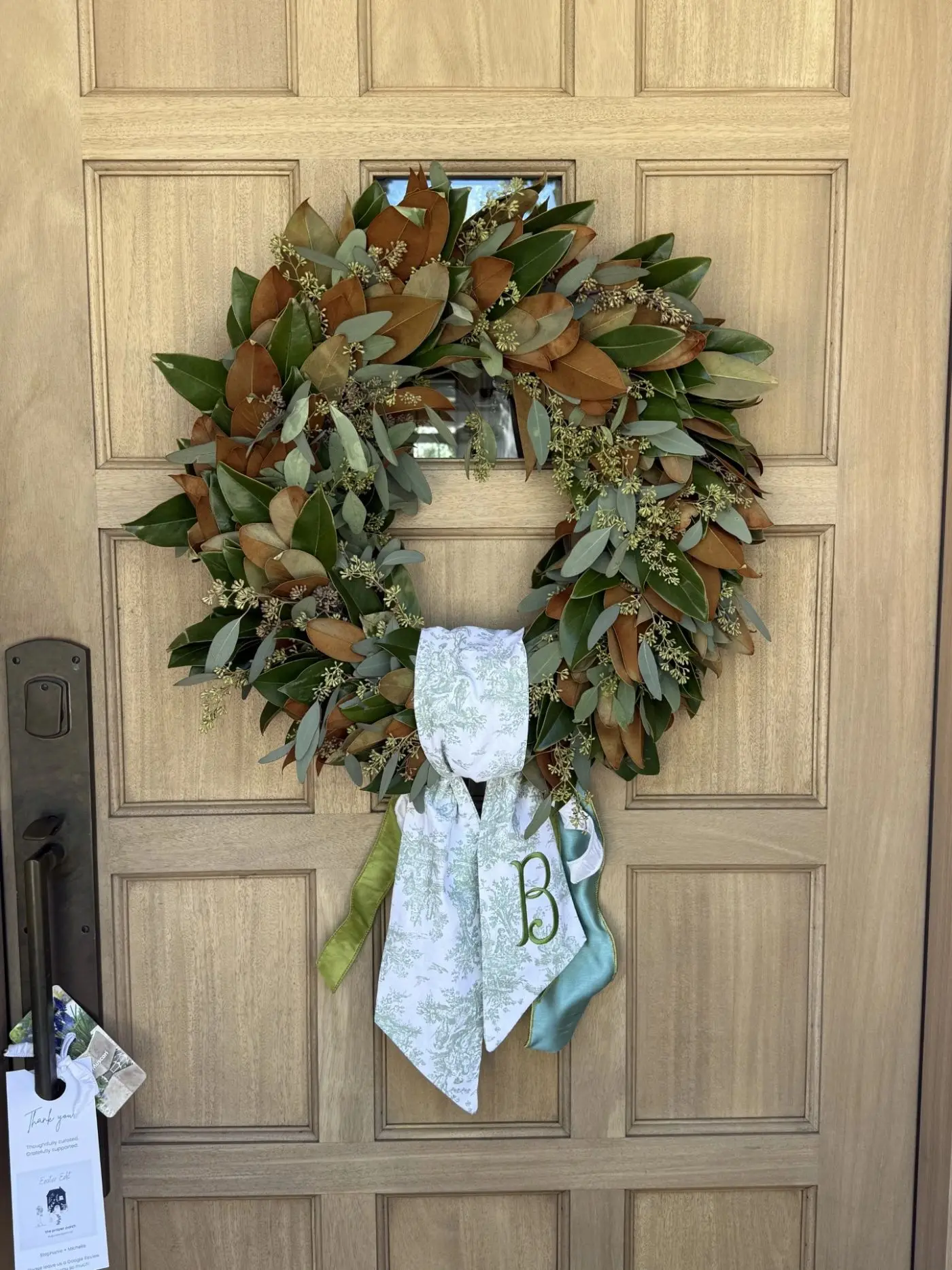 Fresh winter wreath on a front door in West University